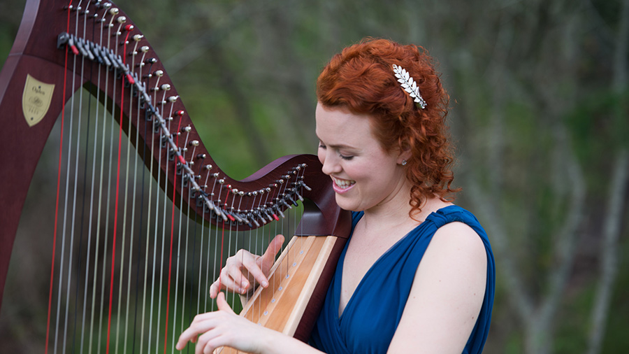 Christy-Lyn in blue dress playing lever harp
