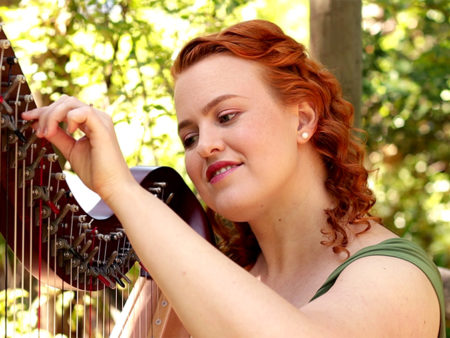 Christy-Lyn with harp in a forest