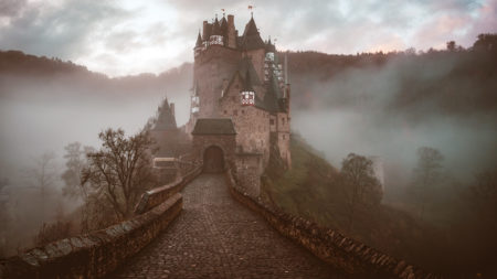 misty castle by a mountain
