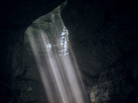 Light rays spilling though cave